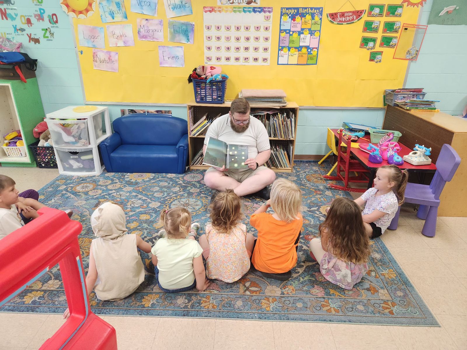 Pastor reads to the Primary Care children.